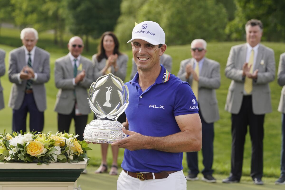 Billy Horschel poses with his trophy after winning the Memorial golf tournament Sunday, June 5, 2022, in Dublin, Ohio. (AP Photo/Darron Cummings)