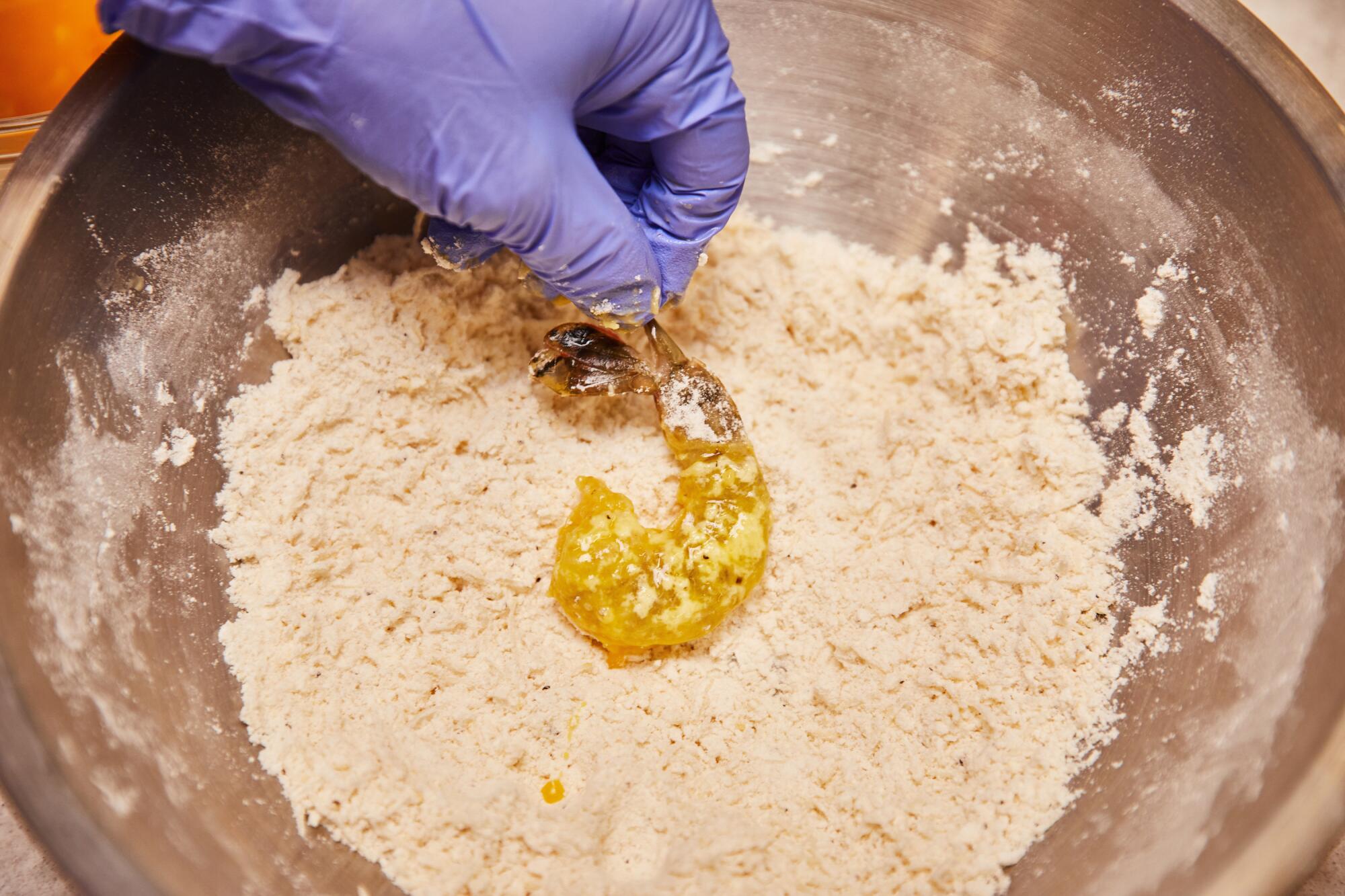 Preparation of fried shrimp.
