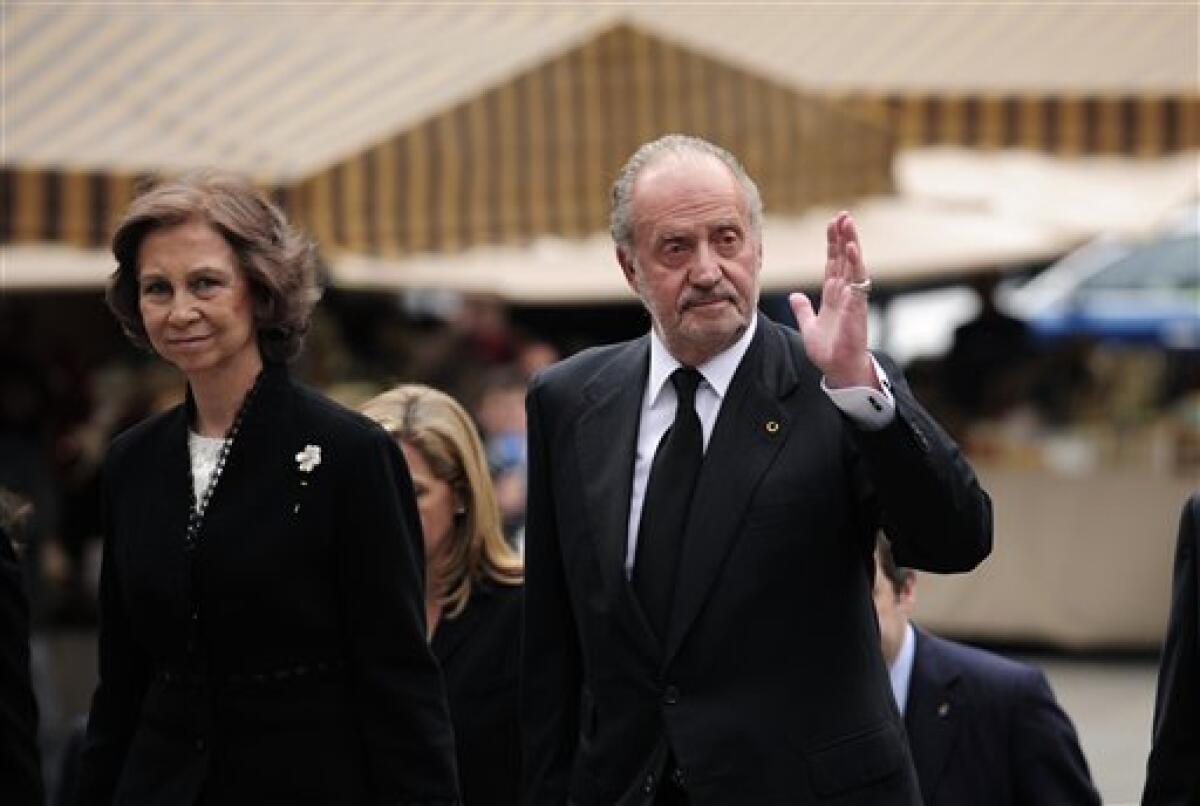 Spain's King Juan Carlos and Queen Sofia greet journalists as they arrive to attend the funeral of former International Olympic Committee president Juan Antonio Samaranch at the cathedral in Barcelona, Spain, on Thursday, April 22, 2010. Former International Olympic Committee president Juan Antonio Samaranch died Wednesday at age 89 in the Quiron Hospital in his home city of Barcelona of cardio-respiratory failure three days after being admitted with heart problems. (AP Photo / David Ramos)