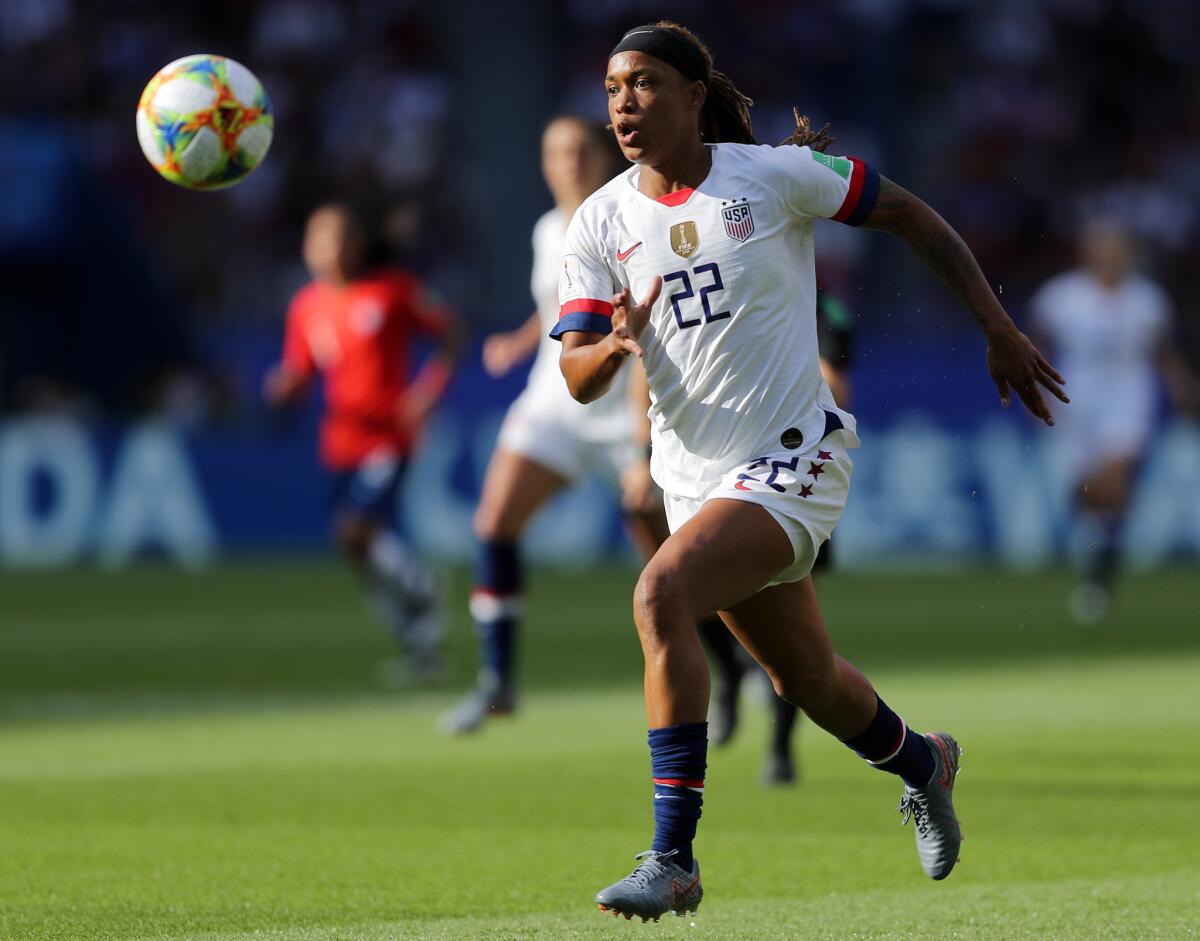 Jessica McDonald runs with the ball during the team's 3-0 victory over Chile.