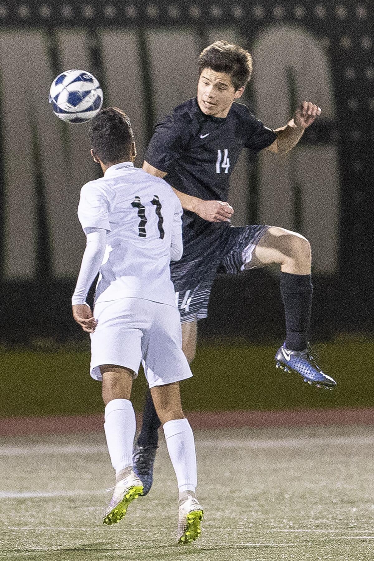 Sage Hill's Jonathan Lake goes up for a header against St. Anthony's Nick Sparks.