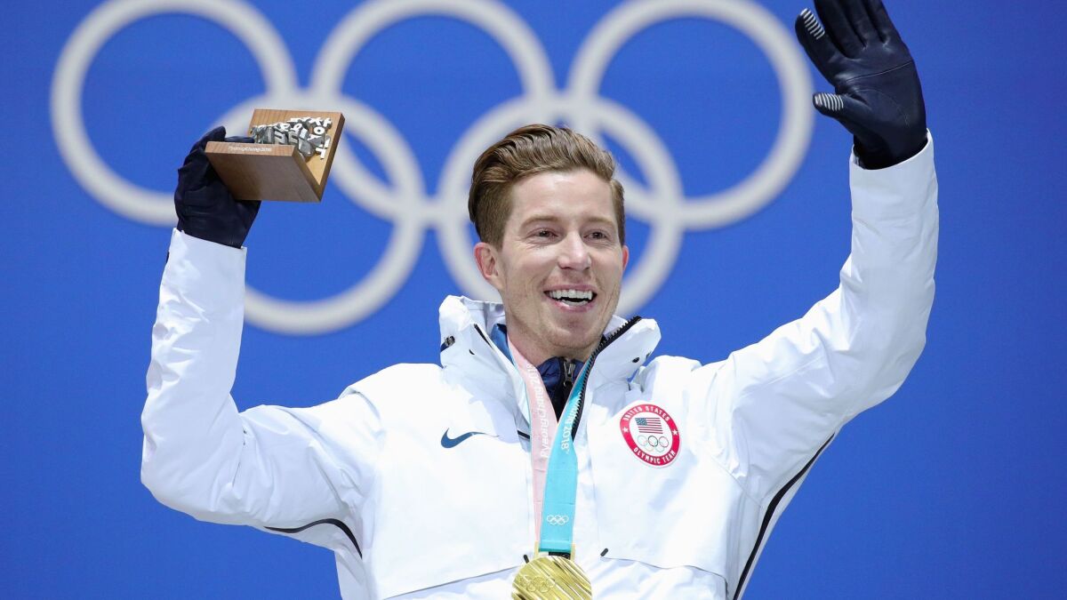 U.S. snowboarder Shaun White celebrates his gold medal victory Thursday at the Winter Olympics in Pyeongchang, South Korea. NBC offered live video of his victory on Snapchat, the social media app.