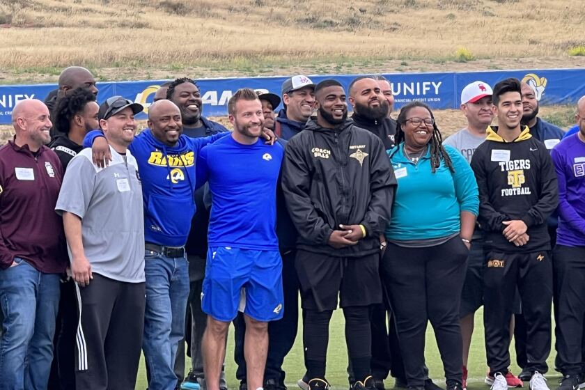 Rams coach Sean McVay poses with more than 60 high school football coaches at Rams training camp 