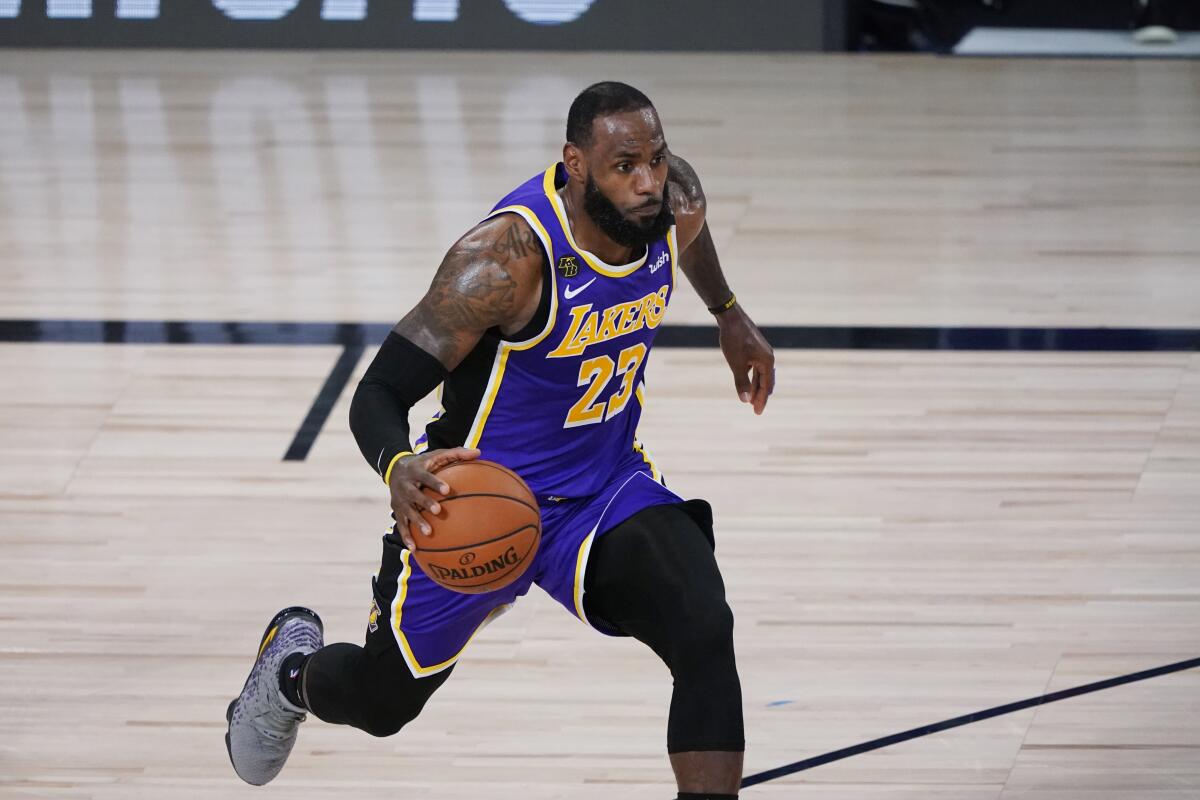 The Lakers' LeBron James drives against Portland during the first half Aug. 22, 2020.