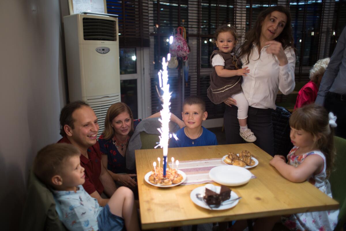 Tsvetelina and Svilen Hristov celebrate the birthday of their son Toma at a restaurant in Sofia.