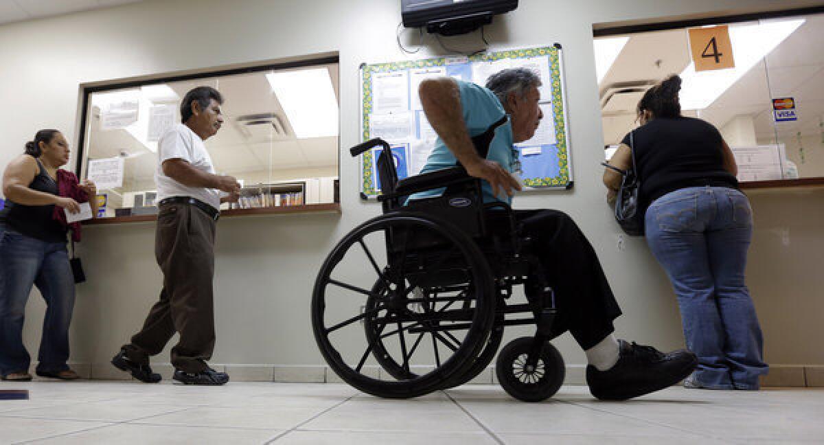 Patients wait in line at Nuestra Clinica Del Valle in San Juan, Texas.