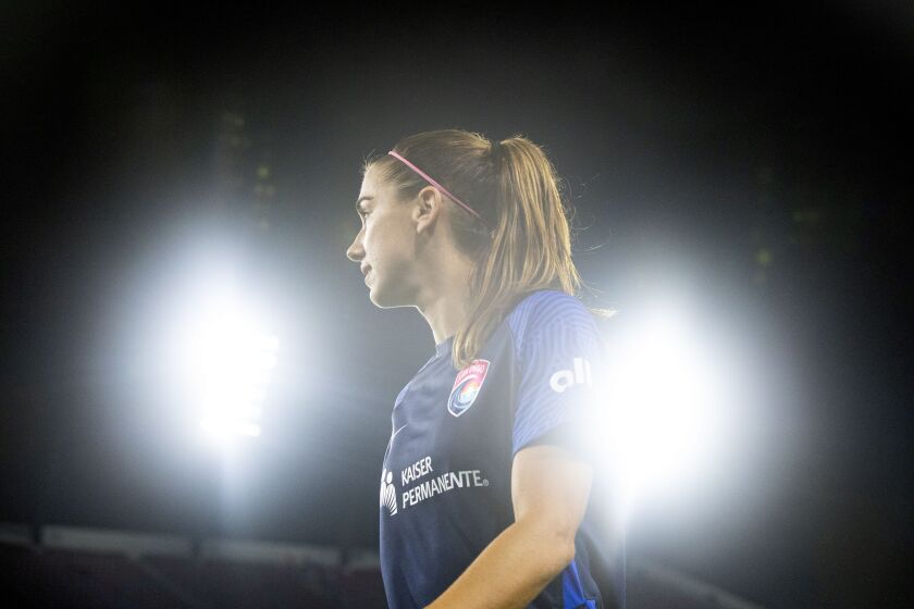 San Diego, CA - September 17: San Diego Wave forward Alex Morgan walks over to sign autographs for fans after their game against Angel City at Snapdragon Stadium on Saturday, Sept. 17, 2022 in San Diego, CA. (Meg McLaughlin / The San Diego Union-Tribune)