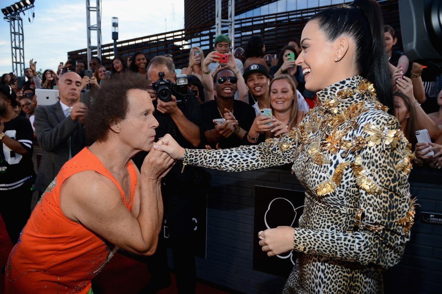 Exercise guru Richard Simmons greets Katy Perry.