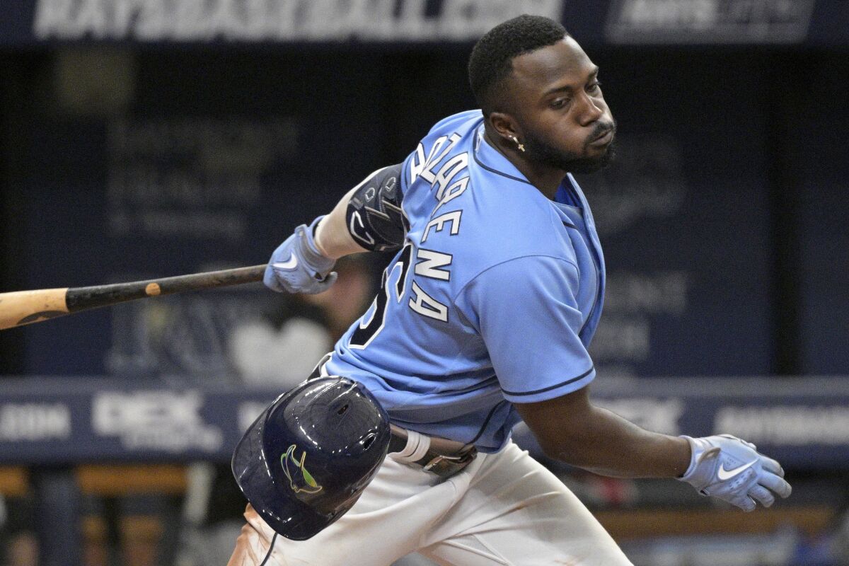 Tampa Bay Rays' Randy Arozarena loses his batting helmet while striking out during the eighth inning of a baseball game against the Chicago White Sox, Sunday, June 5, 2022, in St. Petersburg, Fla. (AP Photo/Phelan M. Ebenhack)