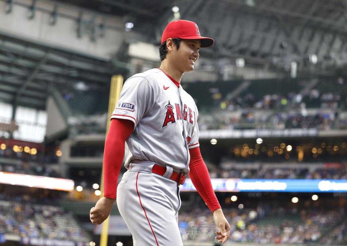 Angels two-way star Shohei Ohtani walks on the field before the game April 29, 2023, in Milwaukee. 