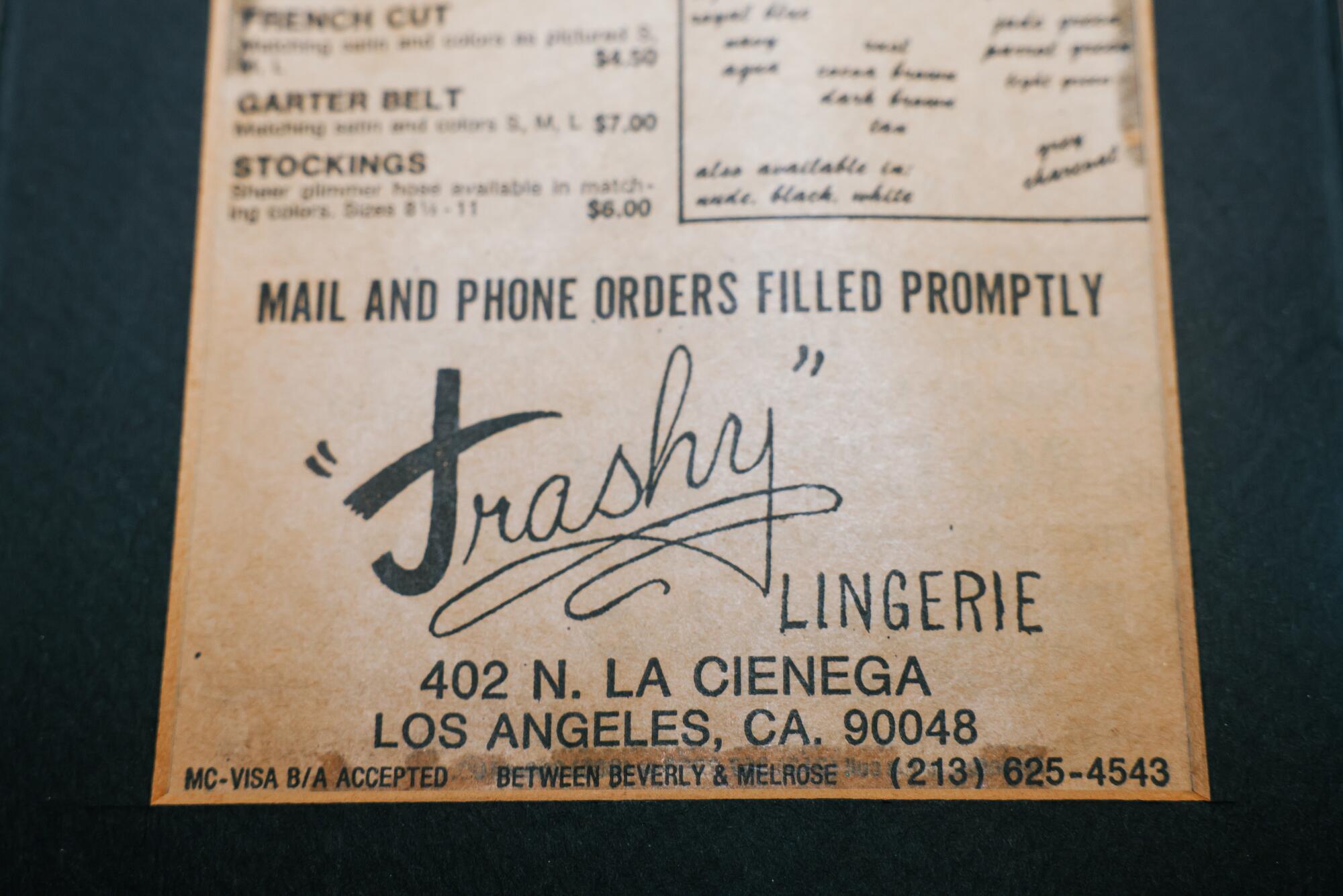 A vintage newspaper clipping shows an advertisement for Trashy Lingerie.