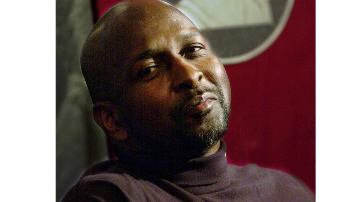 Former Philadelphia 76ers center Moses Malone, shown in 2001, has died.
