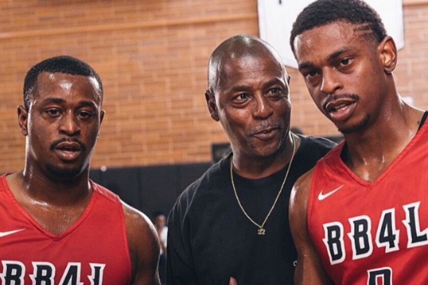Casper Ware Jr. (right), with his father and brother, Ervin, at the Drew League.