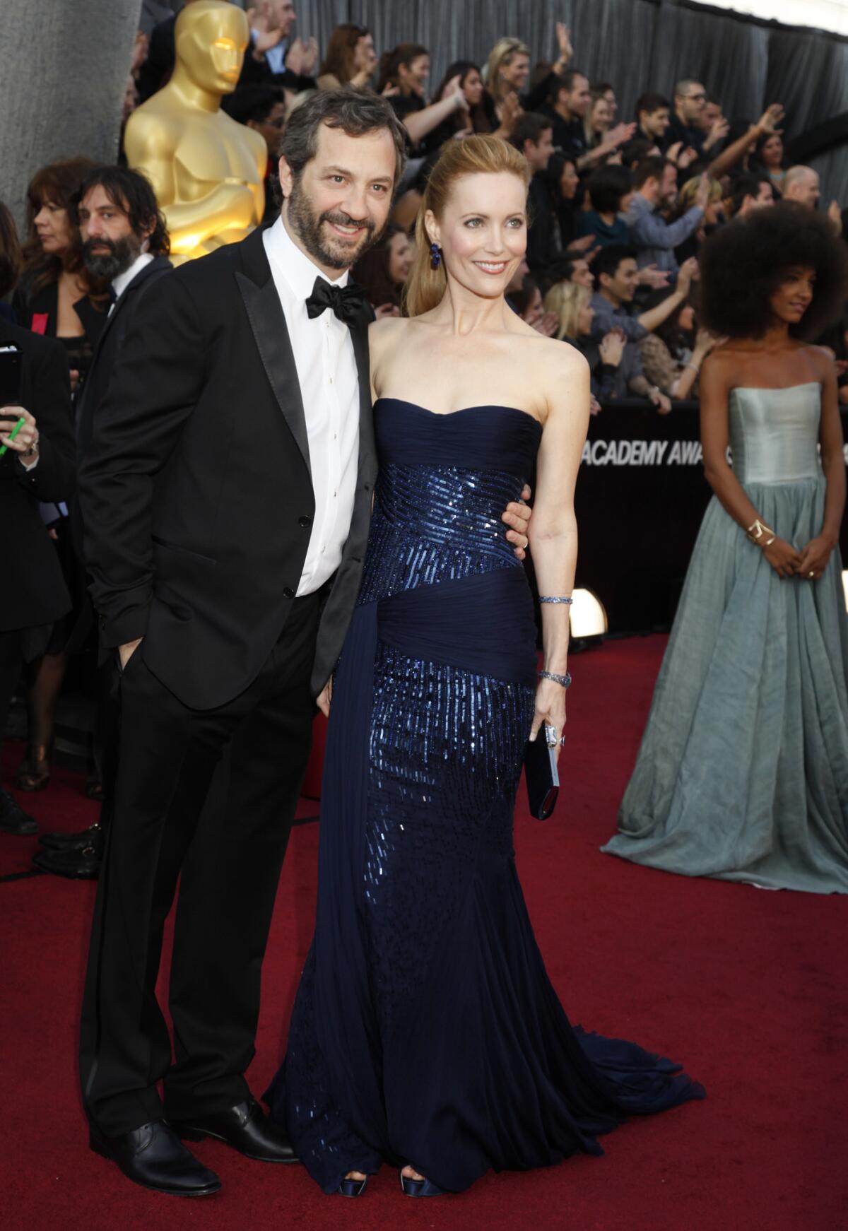 Judd Apatow and Leslie Mann attend the 84th Annual Academy Awards in 2012.