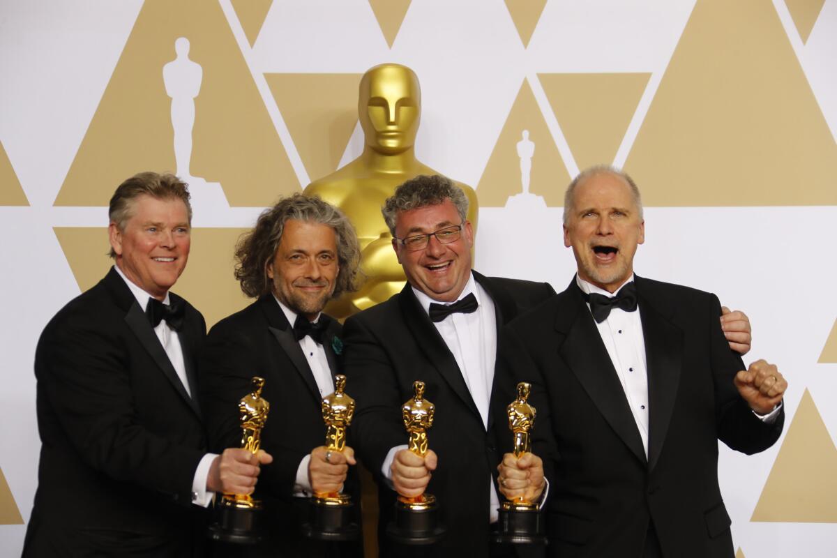 "Blade Runner 2049's" Richard R. Hoover, Paul Lambert, Gerd Nefzer and John Nelson, winners of the Oscar for visual effects in the photo room at the 90th Academy Awards,