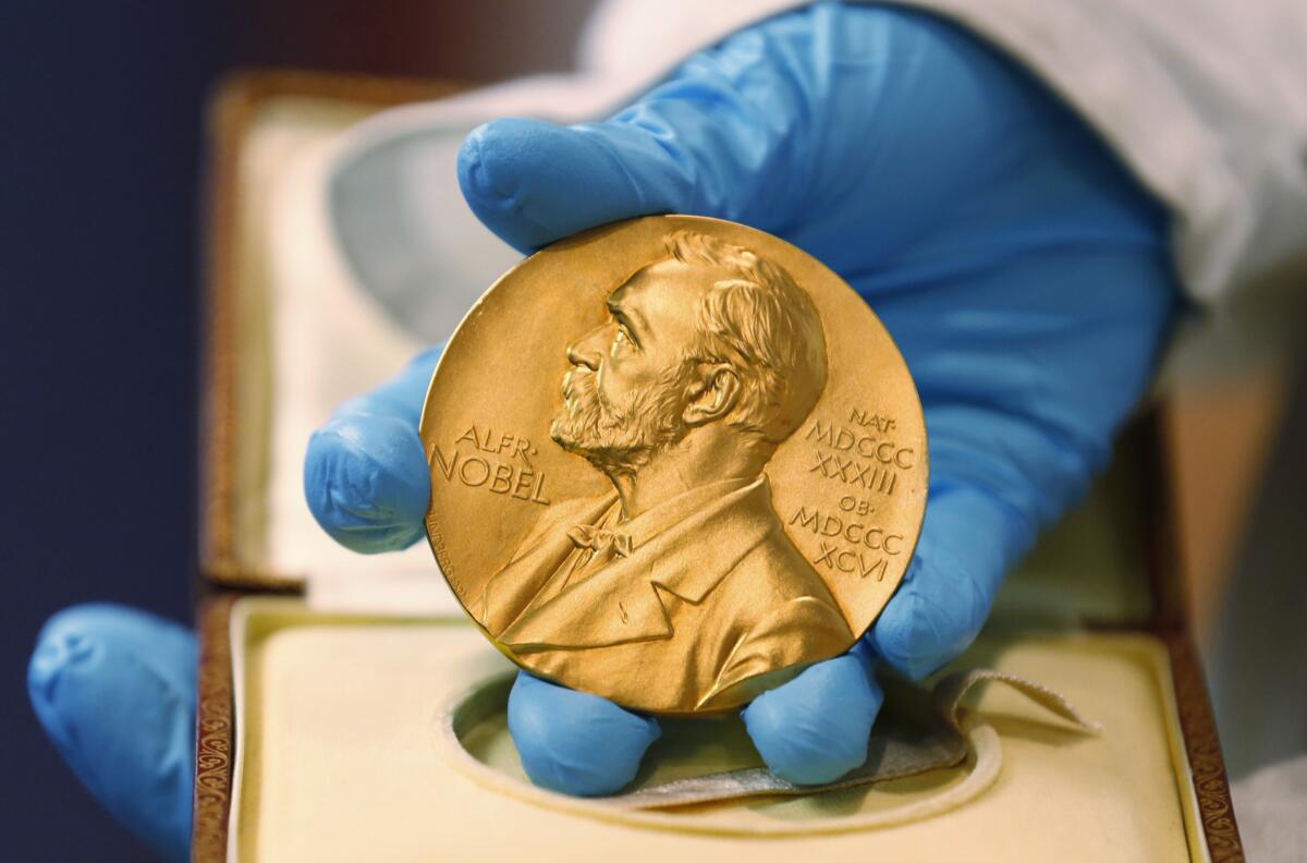 A gold Nobel Prize medal.