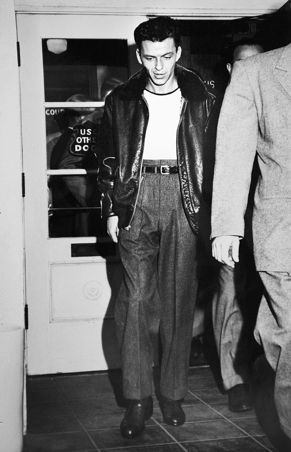 A rare Los Angeles Times photo of Frank Sinatra in 1947, leaving a Beverly Hills courthouse after charges against him for allegedly slugging columnist Lee Mortimer were dismissed.