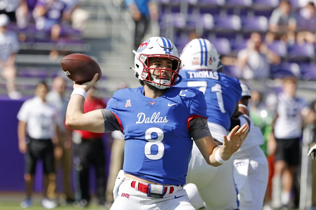 SMU quarterback Tanner Mordecai (8) throws a pass against TCU during the first half of an NCAA football game in Fort Worth, Texas, Saturday, Sept. 25, 2021. (AP Photo/Michael Ainsworth)