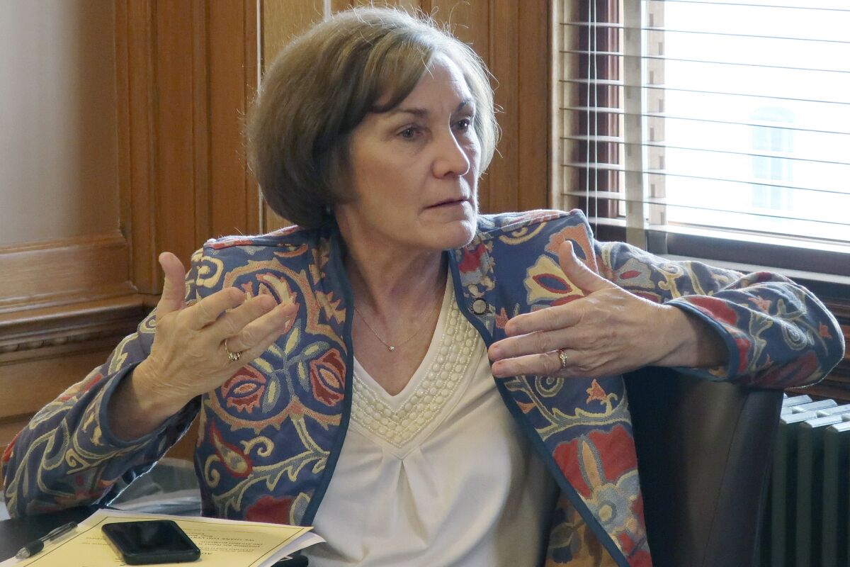 FILE - In this Feb. 13, 2019, file photo, state Sen. Barbara Bollier, D-Mission Hills, speaks during a meeting of Democratic senators at the Statehouse in Topeka, Kan. Bollier is pitching herself as a “voice of reason” with a decade's worth of working with lawmakers from both parties (AP Photo/John Hanna File)