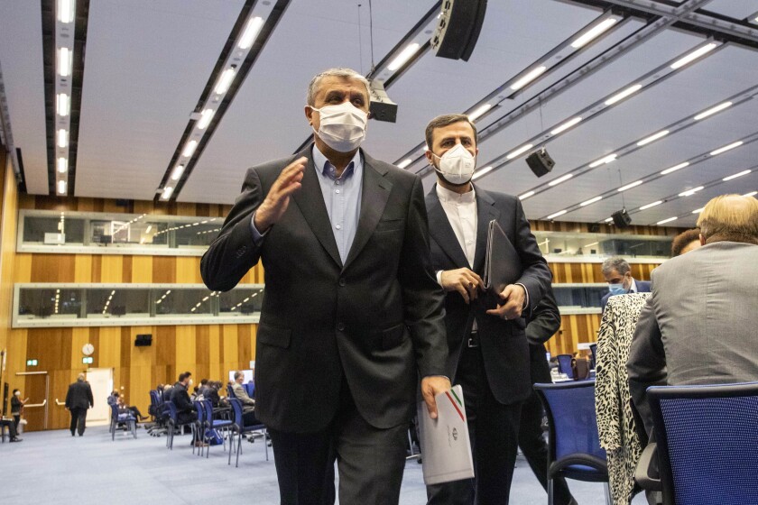 FILE - Mohammad Eslami, new head of Iran's nuclear agency (AEOI), left, and Iran's Governor to the International Atomic Energy Agency (IAEA), Kazem Gharib Abadi, leave the International Atomic Energy's (IAEA) General Conference in Vienna, Austria, Monday, Sept. 20, 2021. The European diplomat chairing nuclear talks between Iran and world powers says negotiations in Vienna will resume Thursday, Dec. 9, 2021. Enrique Mora tweeted Wednesday that the parties to the 2015 Vienna accord will meet in the Austrian capital after consulting with their governments in recent days. (AP Photo/Lisa Leutner, File)