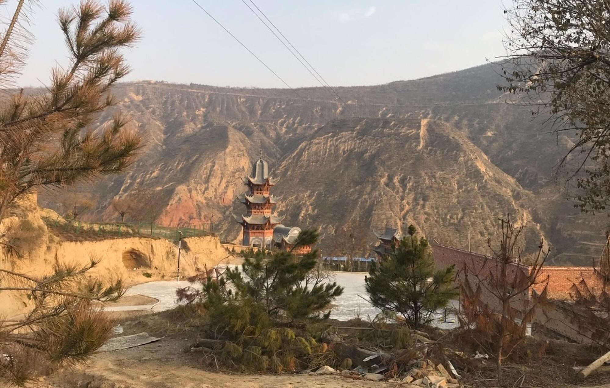 An old Islamic-Chinese tower stands over the Dongxiang minority village of Bulengou.