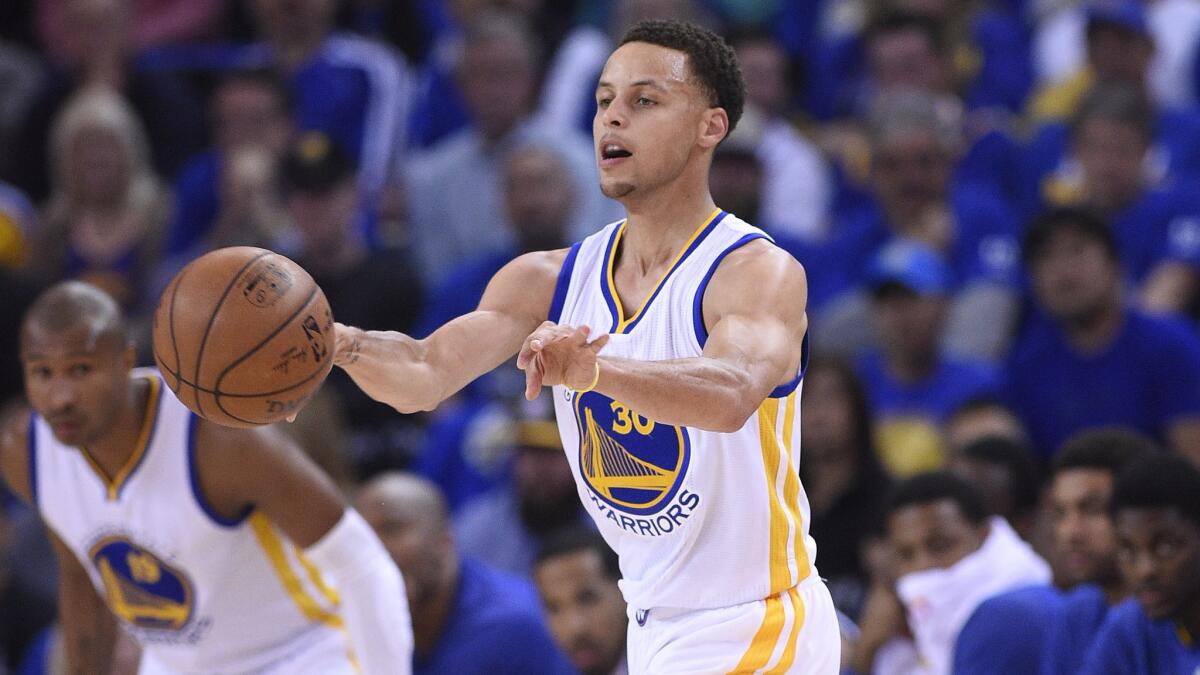 Golden State Warriors point guard Stephen Curry passes during a win over the Denver Nuggets on Wednesday.