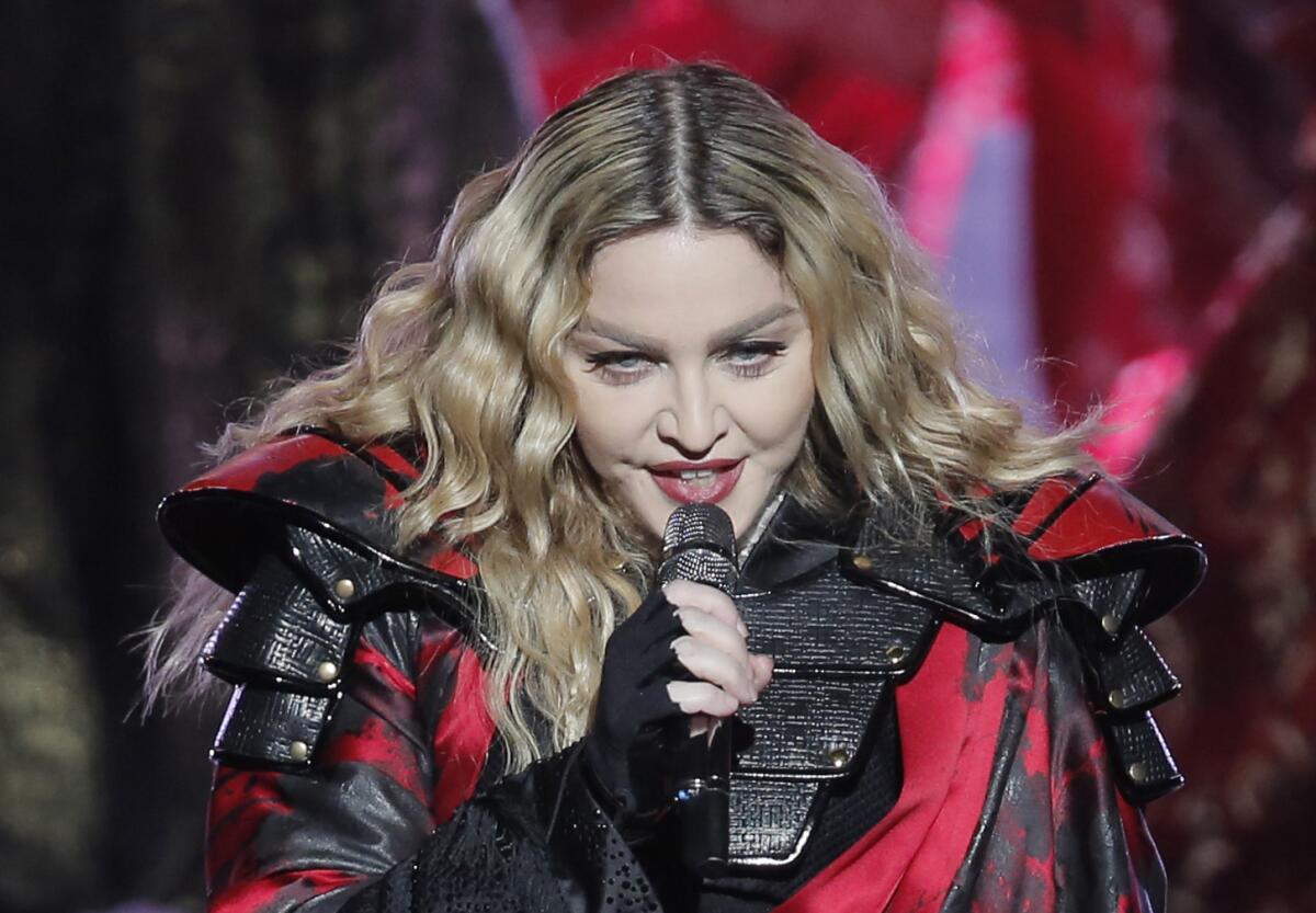 Madonna fan isn't offended after the singer exposed the 17-year-old's breast  onstage - Los Angeles Times