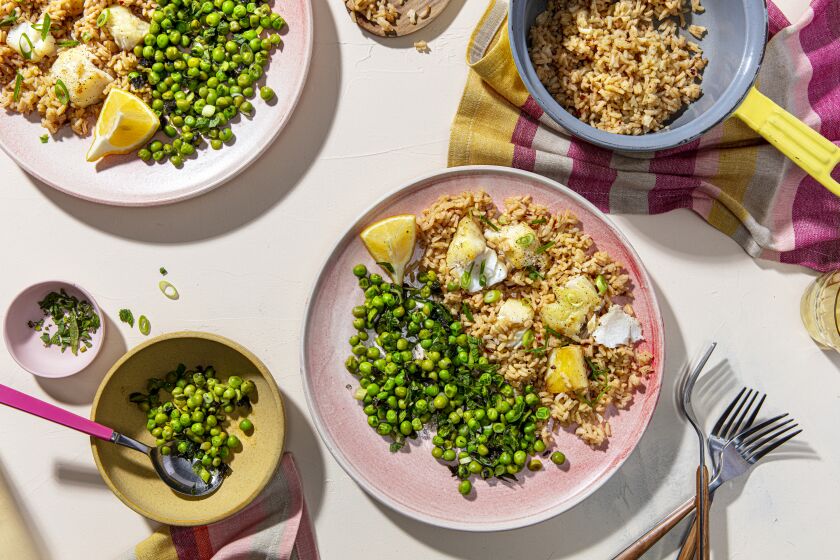 LOS ANGELES, CALIFORNIA, March 5, 2021: A Spiced Rice and Fish with Minty Peas for the Week-of-Meals story by Ben Mims, photographed on Friday, March 5, 2021, at Proplink Studios in Arts District Los Angeles. (Photo / Silvia Razgova, Prop styling / Kate Parisian, Food styling / Leah Choi) ATTN: 725766-la-fo-cooking-weekofmeals