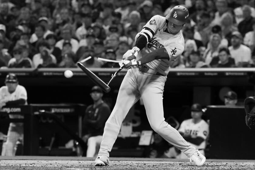 Shohei Ohtani of the Los Angeles Dodgers breaks his bat during game three of the National League Division Series.