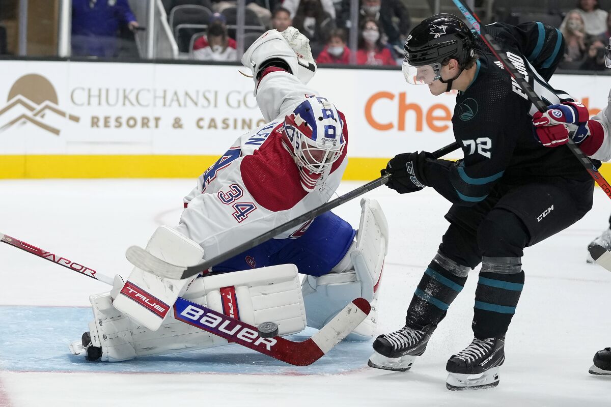 Montreal Canadiens goaltender Jake Allen (34) blocks a shot by San Jose Sharks left wing William Eklund (72) during the third period of an NHL hockey game Thursday, Oct. 28, 2021, in San Jose, Calif. The Canadiens won 4-0. (AP Photo/Tony Avelar)