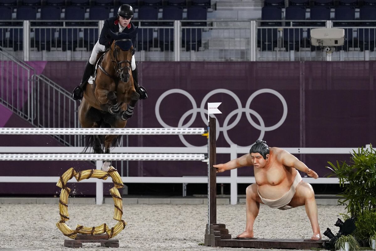 Britain's Harry Charles, riding Romeo 88, competes during the equestrian jumping individual qualifying at Equestrian Park in Tokyo at the 2020 Summer Olympics, Tuesday, Aug. 3, 2021, in Tokyo, Japan. (AP Photo/Carolyn Kaster)