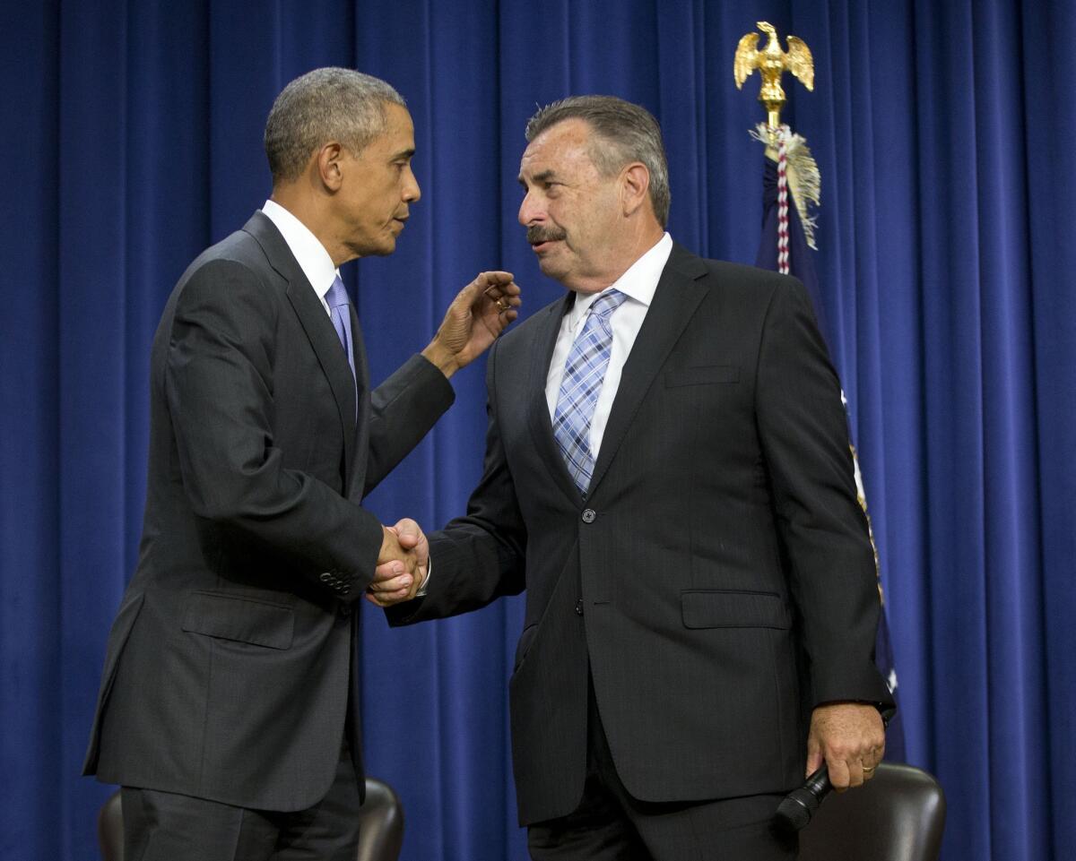 President Obama shakes hands with Los Angeles Police Department Chief Charlie Beck during a forum on criminal justice reform in Washington on Oct. 22.