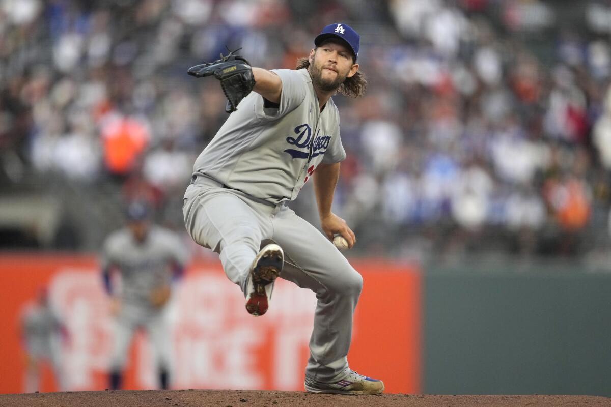 Dodgers pitcher Clayton Kershaw works against the San Francisco Giants.