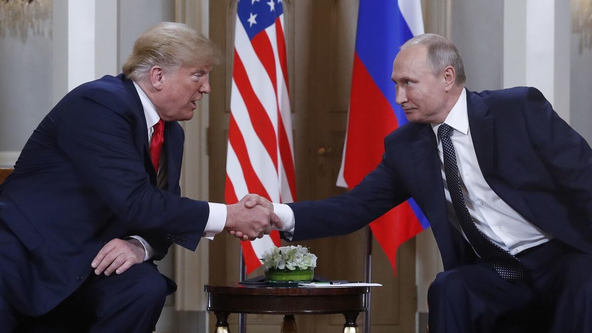 President Trump and Russian President Vladimir Putin greet each other July 16 at their meeting in Helsinki, Finland.