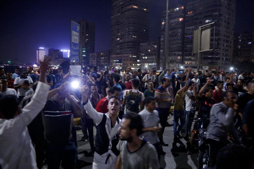 Egyptian protesters shout slogans as they take part in a protest calling for the removal of President Abdel Fattah al-Sisi in Cairo's downtown on September 20, 2019.