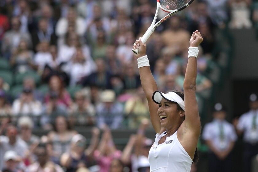 Britain's Heather Watson celebrates defeating Slovenia's Kaja Juvan in a third round women's singles match on day five of the Wimbledon tennis championships in London, Friday, July 1, 2022. (AP Photo/Alastair Grant)
