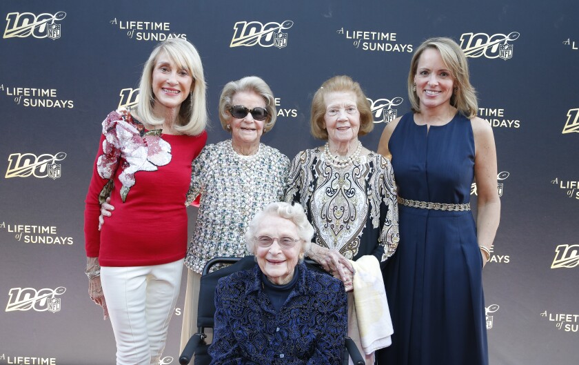 NFL owners, standing from left, Norma Hunt,  Martha Ford and Patricia Rooney, with Jane Skinner Goodell, wife of the NFL commissioner. Seated in front of them is owner Virginia Halas McCaskey.