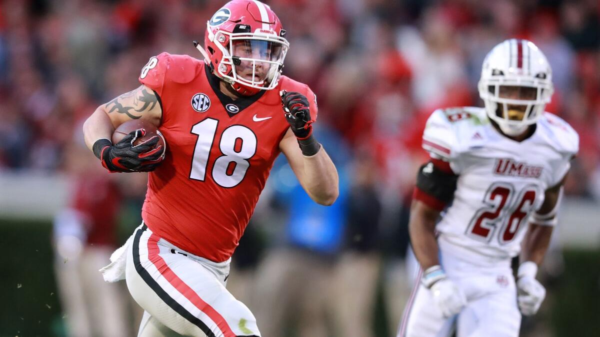 Georgia tight end Isaac Nauta (18) breaks away for a long gain against Massachusetts during the first half on Nov. 17.