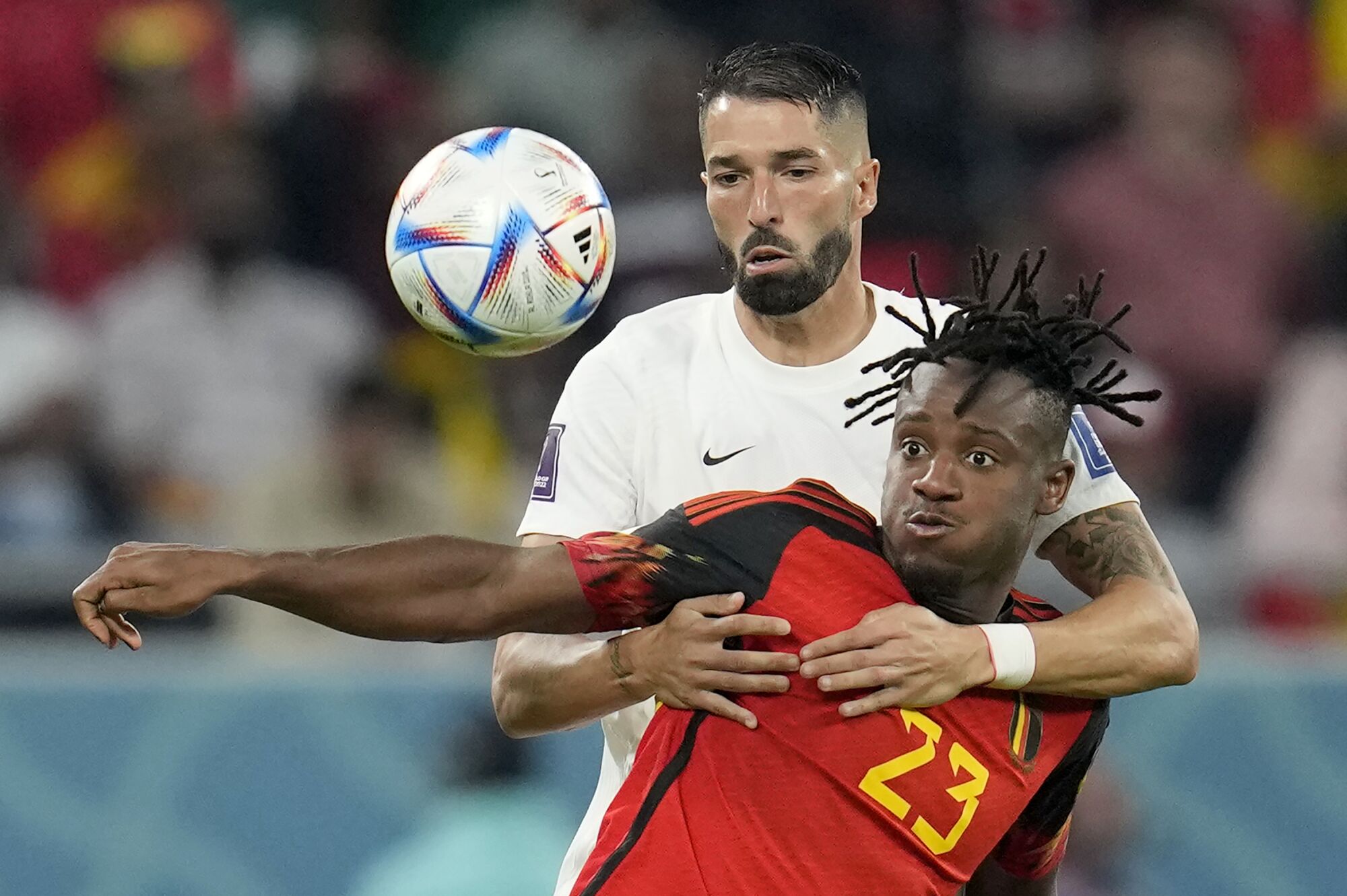 Steven Vitoria of Canada fights for the ball with Michy Batshuayi of Belgium