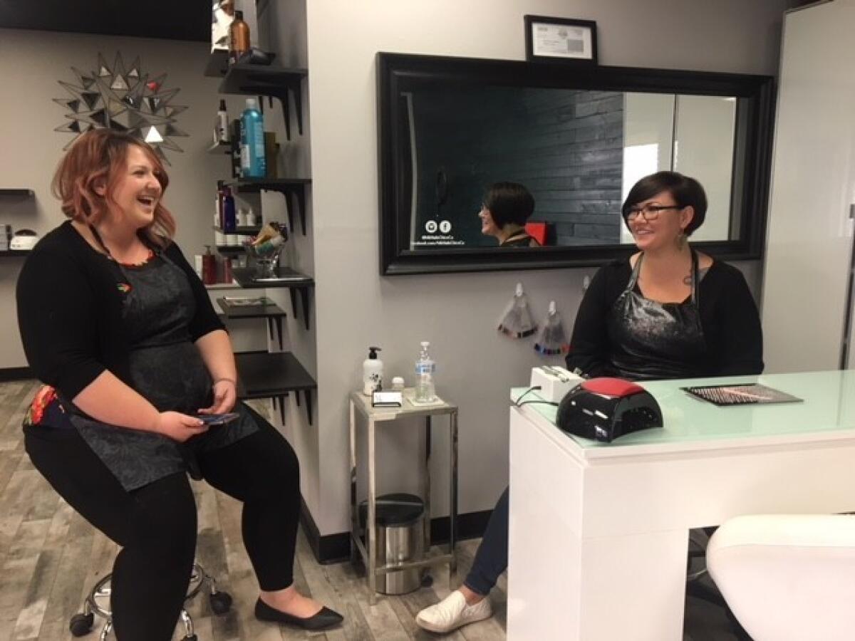 Holly Little, left, and Megan Killingsworth offered free hair washes to fire evacuees at Bleached Salon in Chico.