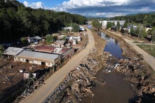 ASHEVILLE, NORTH CAROLINA - OCTOBER 02: An aerial view shows flood damage along the Swannanoa River in the aftermath of Hurricane Helene on October 2, 2024 in Asheville, North Carolina. President Joe Biden took an aerial tour of the devastated region today and has ordered the deployment of 1,000 active duty U.S. soldiers to assist with storm relief efforts and reinforce the North Carolina National Guard. At least 160 people were killed in six states in the wake of the powerful hurricane which made landfall as a Category 4. (Photo by Mario Tama/Getty Images)