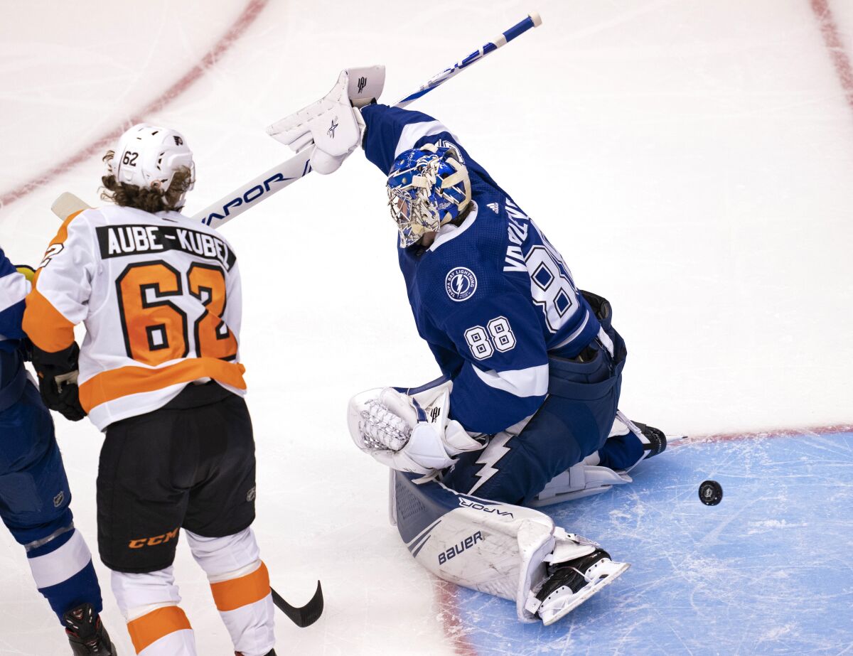 Philadelphia Flyers right wing Nicolas Aube-Kubel (62) scores on Tampa Bay Lightning goaltender Andrei Vasilevskiy (88) during the first period of an NHL hockey playoff game Saturday, Aug. 8, 2020, in Toronto. (Frank Gunn/The Canadian Press via AP)