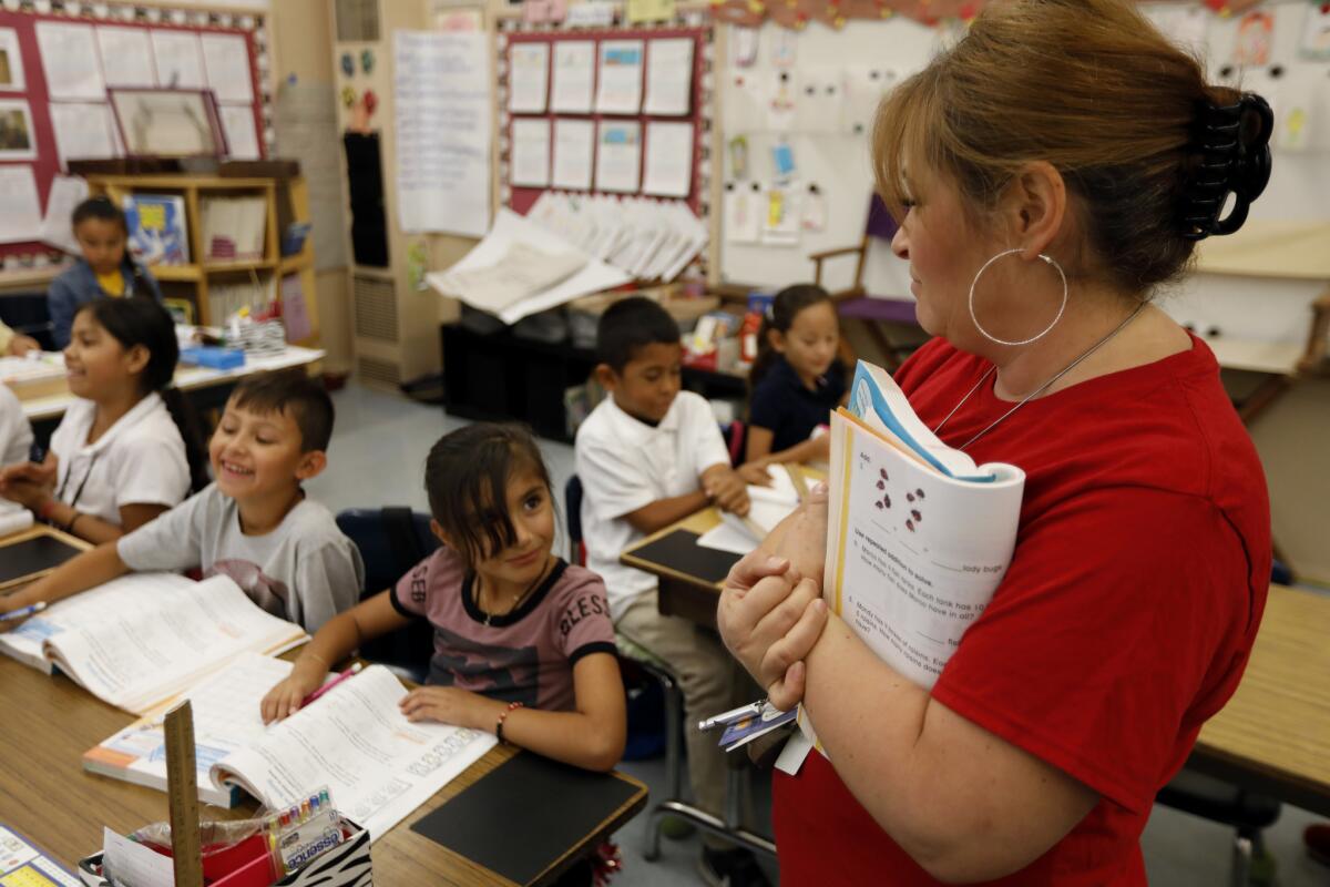 Teacher Rosa Rubalcava with her class at Telfair Elementary in 2018. The school has a large population of students who lack stable housing.