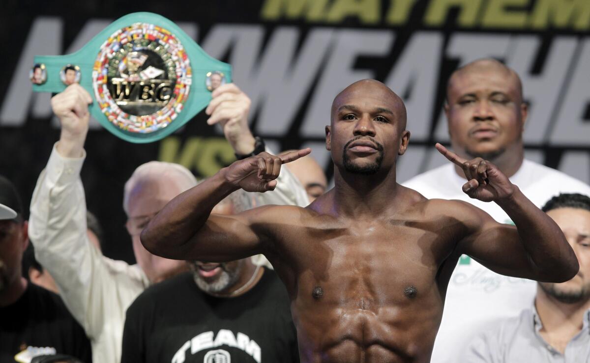 Floyd Mayweather Jr. weighs in for his fight with Marcos Maidana at the MGM Grand Garden Arena on Saturday in Las Vegas.