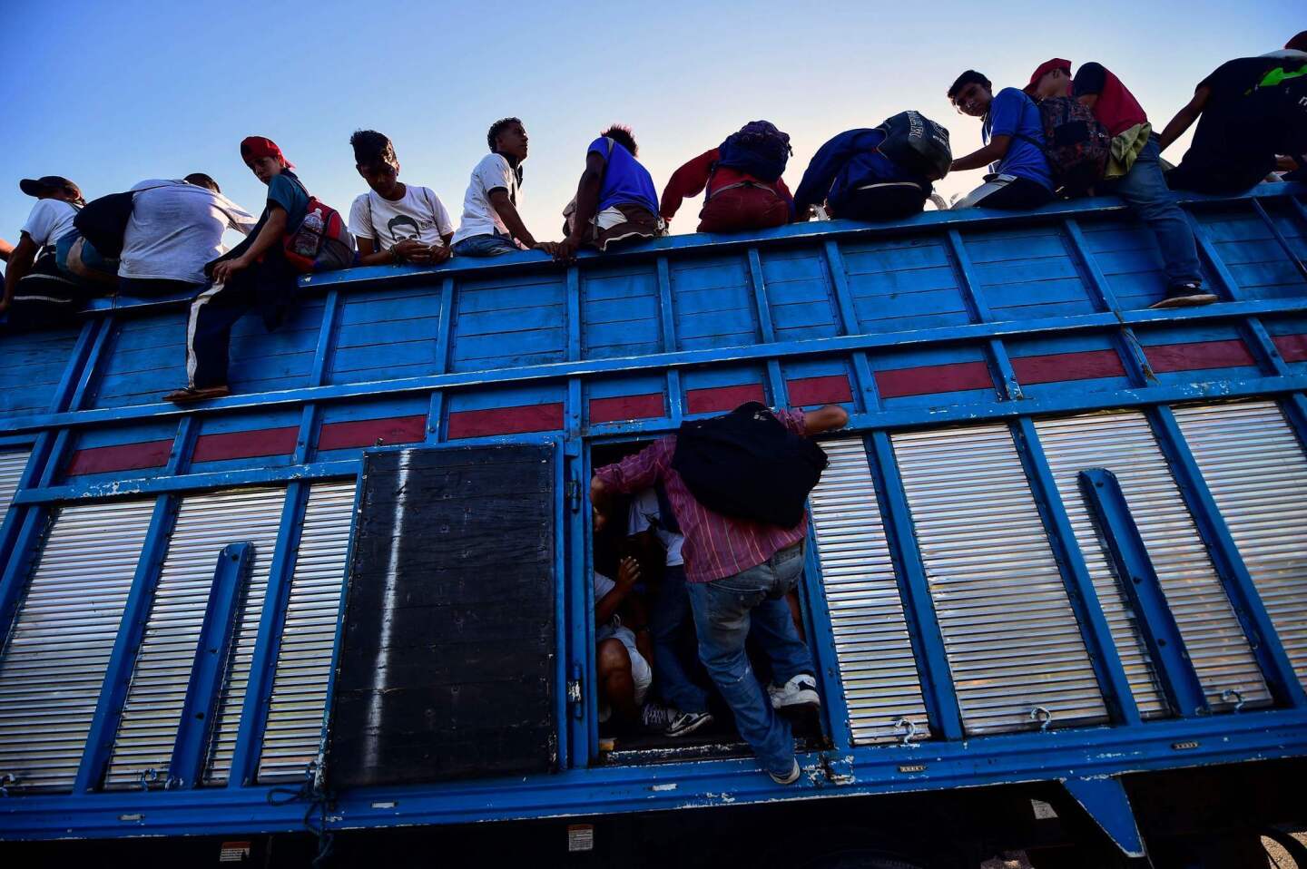 Honduran migrants in a caravan to the U.S. border on their way to Tapachula, Mexico, in a truck.