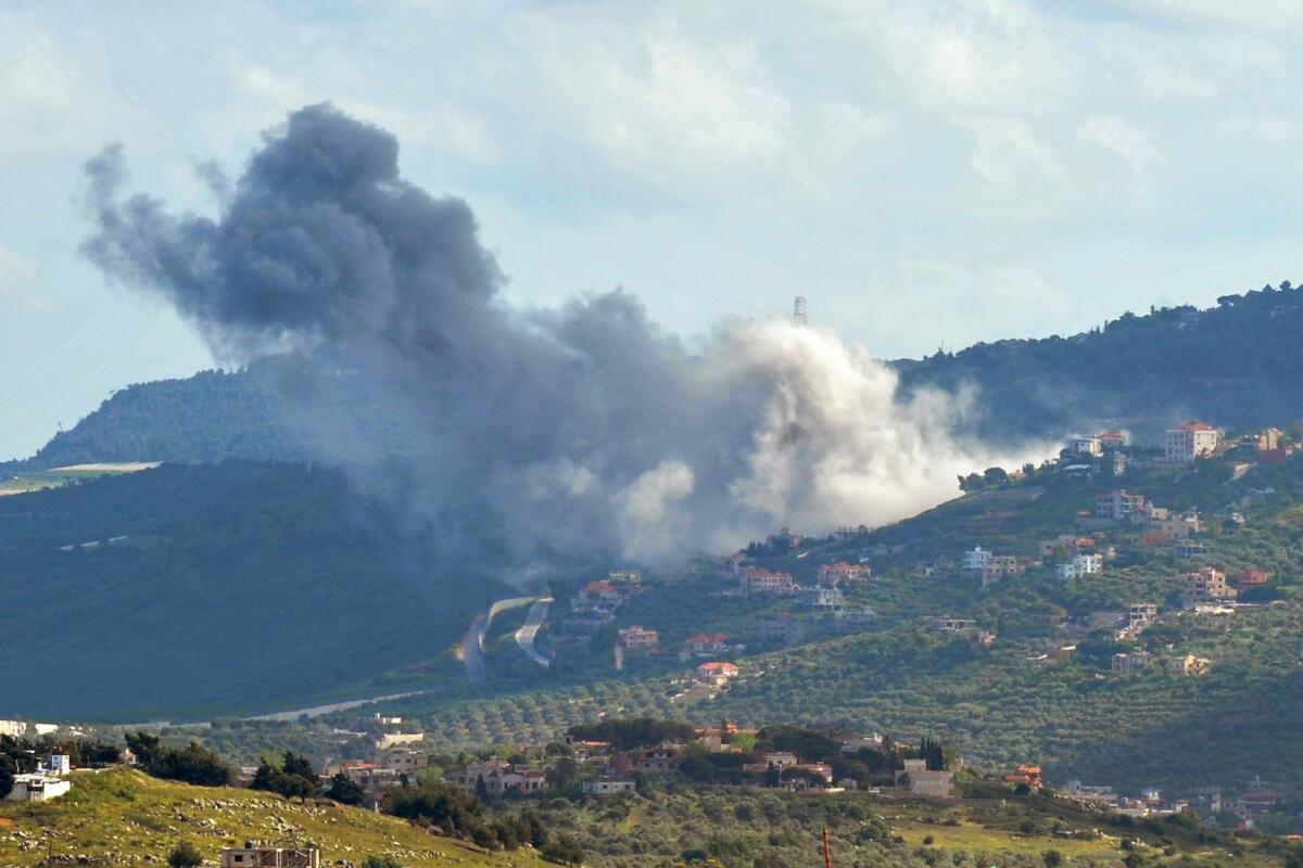Smoke billows following an Israeli airstrike in the hilly area of the southern Lebanese village of Odaisseh.