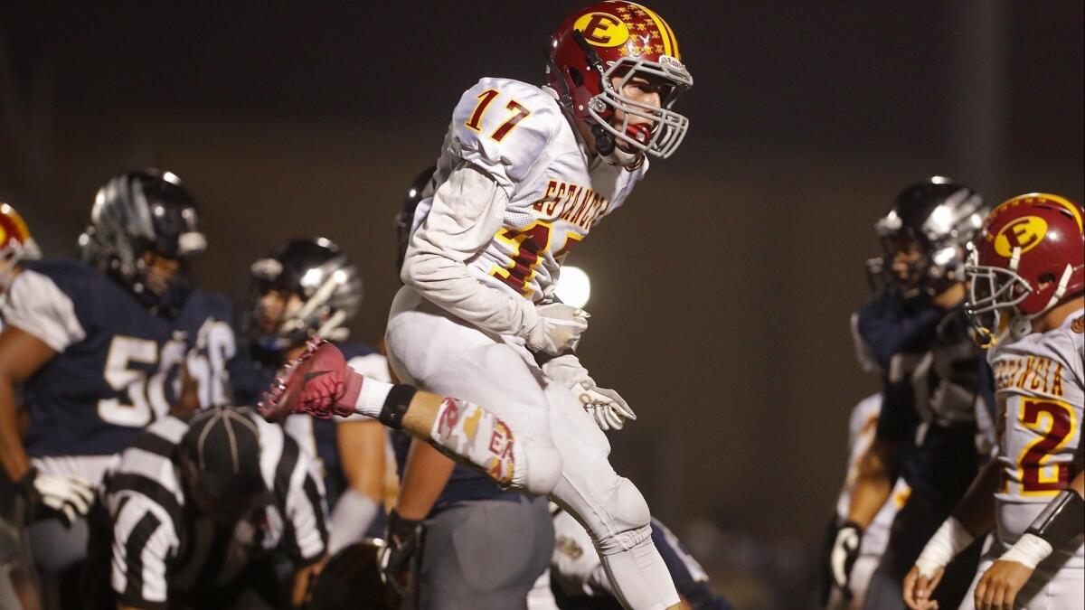 Estancia High's Ryan Carrillo (17) reacts after the defense recovers a fumble against Calvary Chapel during the first half of an Orange Coast League opener at Segerstrom High on Thursday.