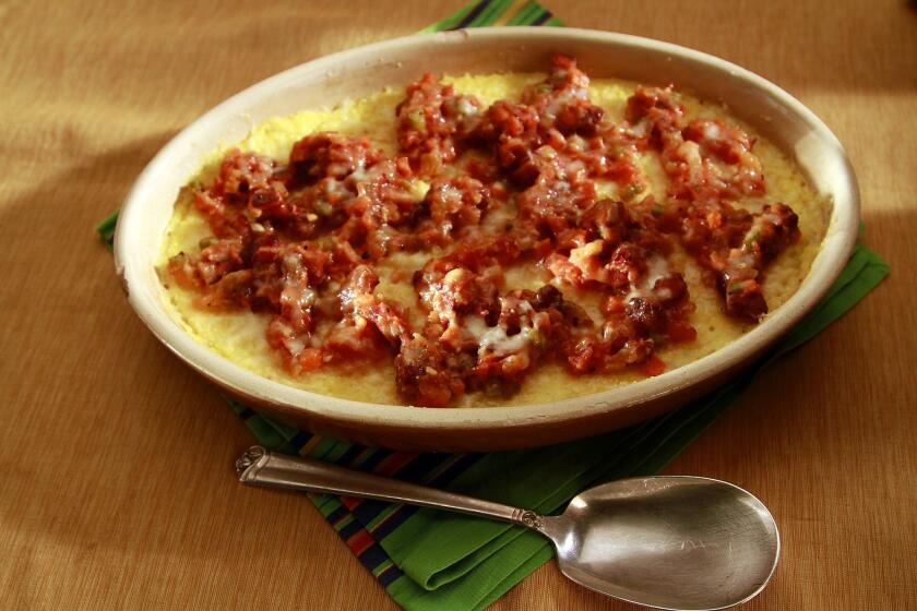 Polenta gratin with Pancetita and tomato sauce.