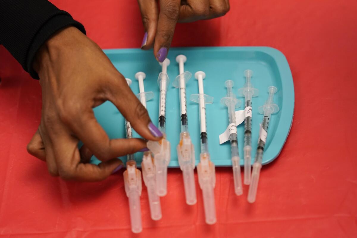 Syringes sit on a tray