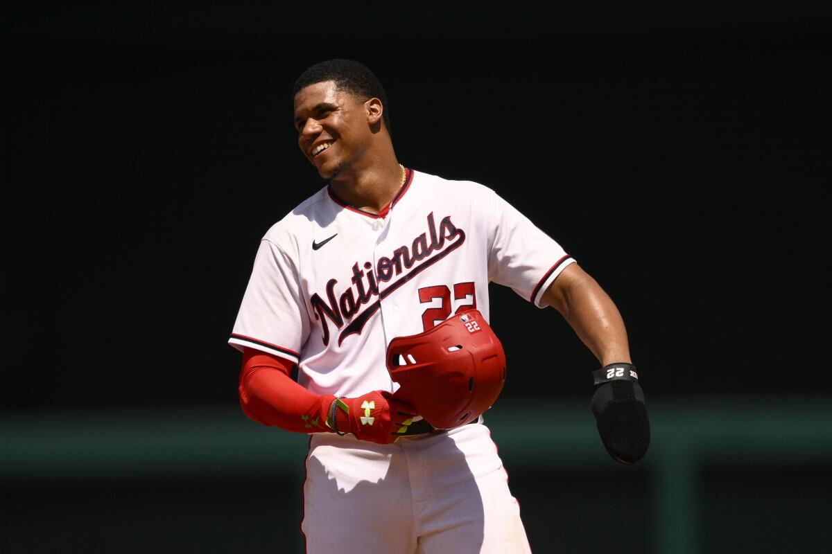 Washington Nationals' Juan Soto smiles as he stands on second during the fourth inning of a baseball game against the Miami Marlins, Sunday, July 3, 2022, in Washington. (AP Photo/Nick Wass)